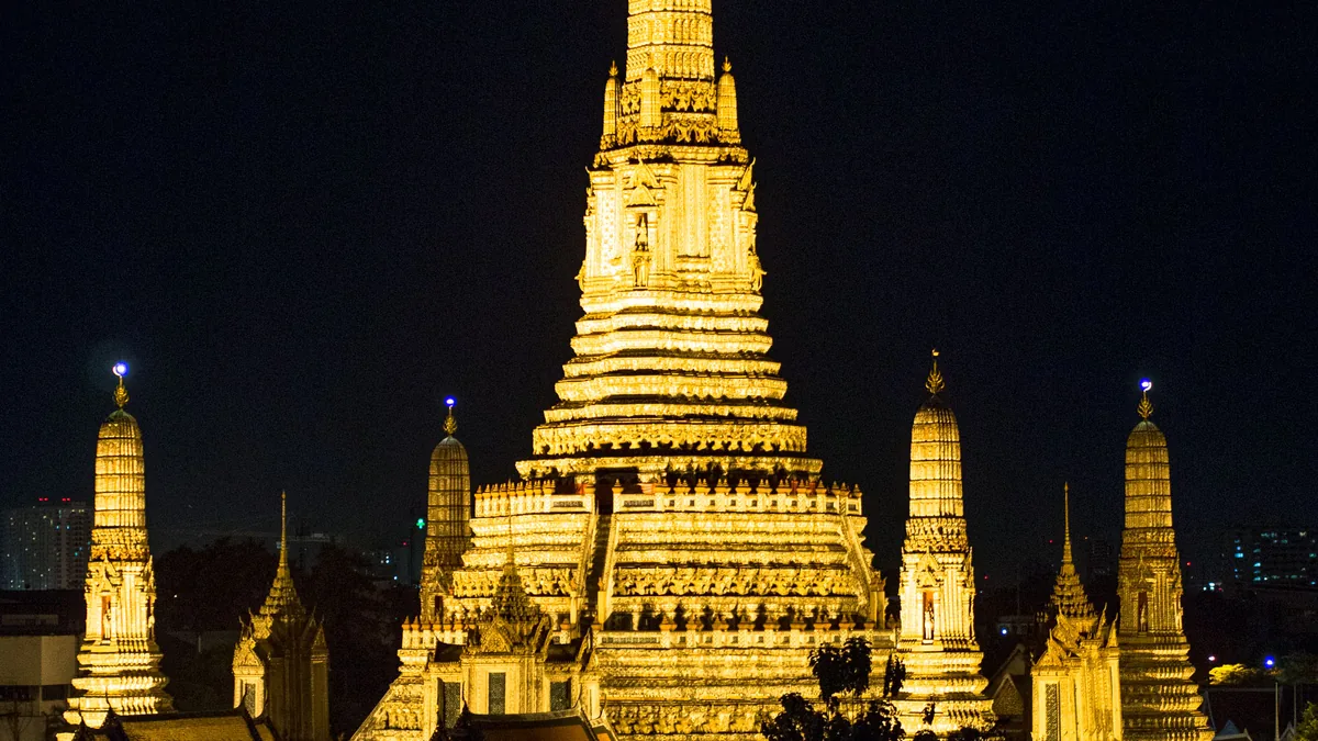 The Wat Arun temple on the Chao Phraya river in Bangkok, Thailand.
